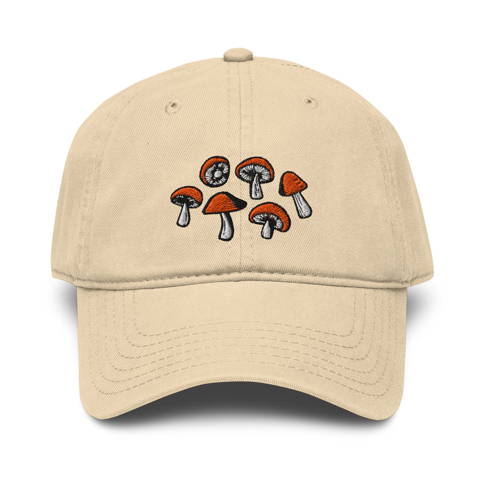 Front view of khaki baseball cap with embroidered cluster of six small mushrooms. Mushrooms have orange caps and white stems.